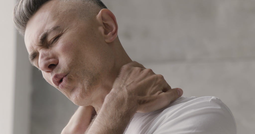 man having neck pain